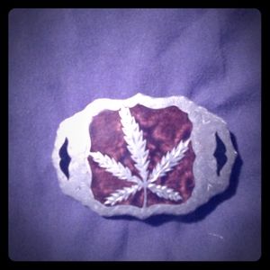 Pot leaf silver belt buckle